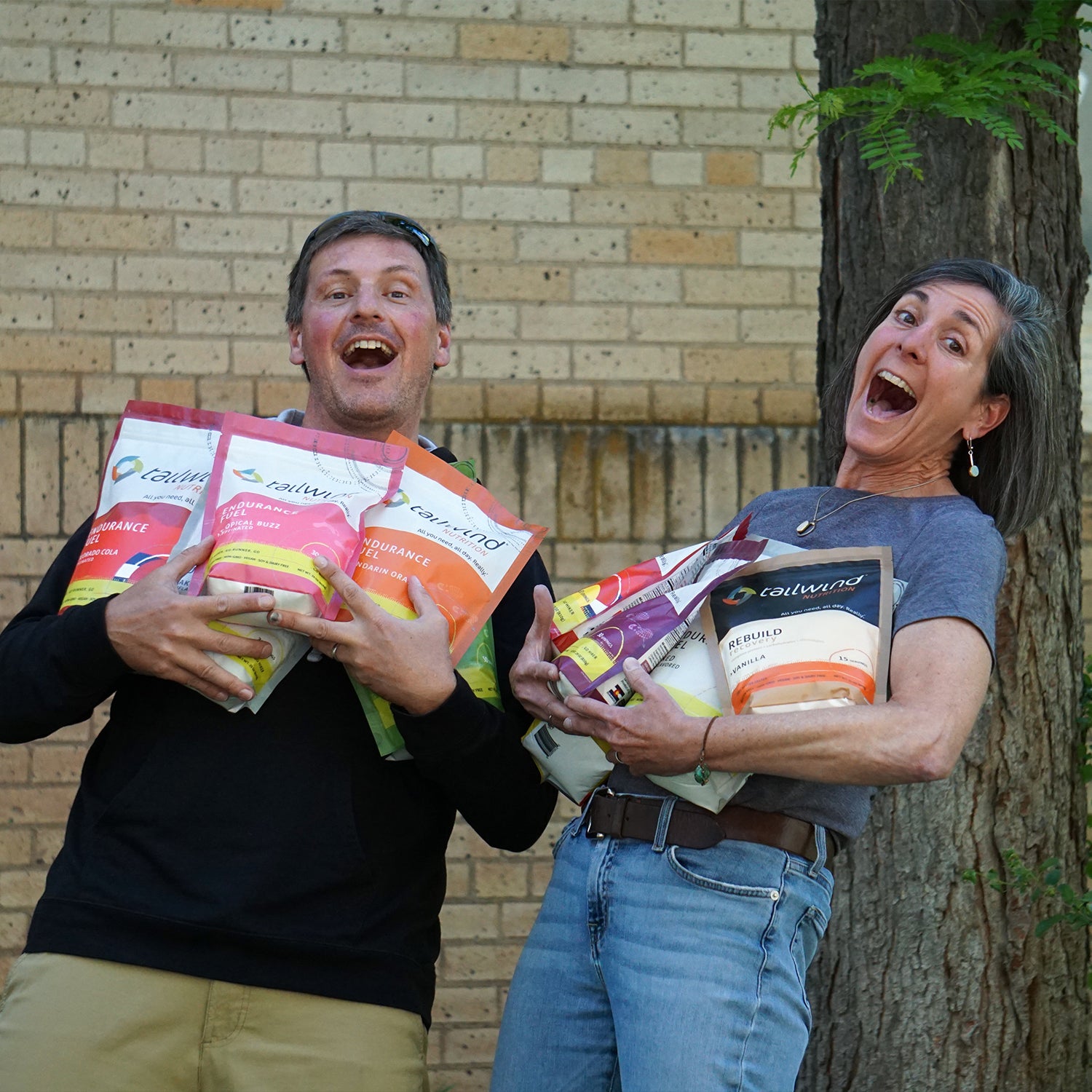 The founders of Tailwind with Tailwind bags