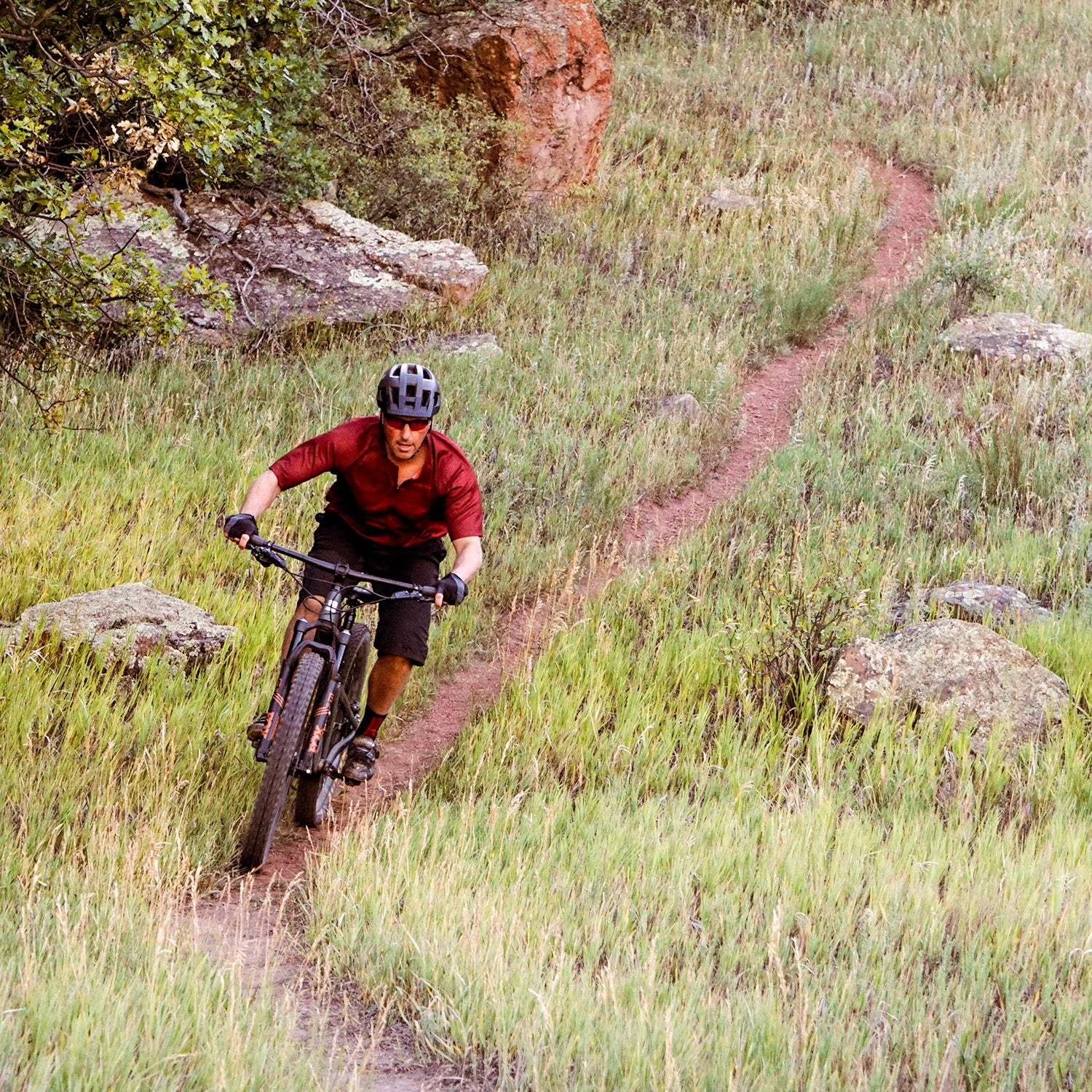 Mountain biker in a grass field